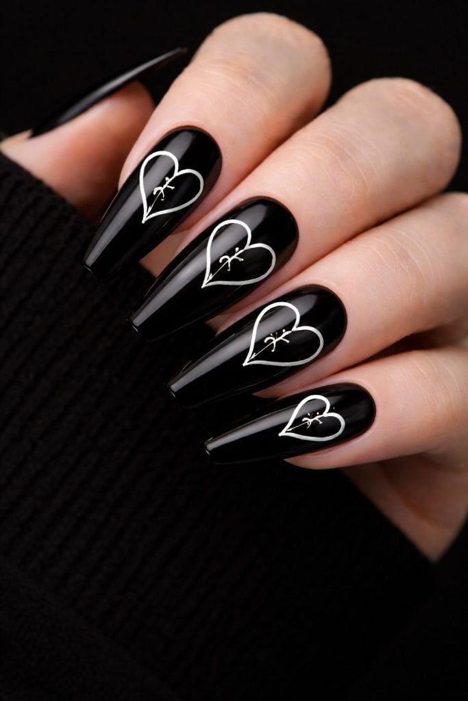 black nails with broken heart nail art 