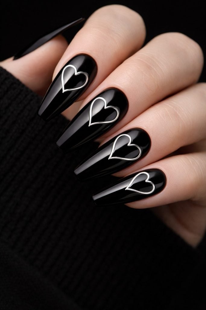 black nails with silver hearts 